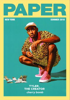 a magazine cover with a man sitting on the ground in front of stacks of money