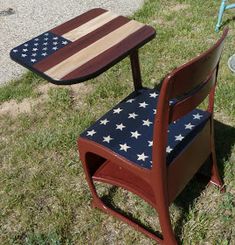 an american flag table and chair sitting in the grass