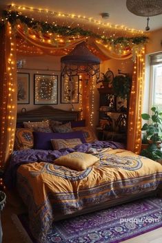 a bedroom decorated in purple and gold with lights