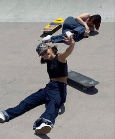 two people are doing tricks on their skateboards