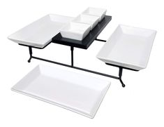 three square tables with black and white trays on each one side, sitting next to each other