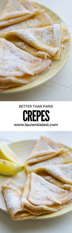 crepes on a plate with lemon wedges