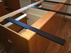 an unfinished kitchen counter top with drawers in it