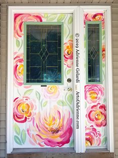 the front door is decorated with colorful flowers and stained glass window panes, which are painted in bright colors