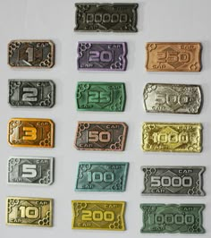 ten different types of money sitting next to each other on a white surface with the number twenty five