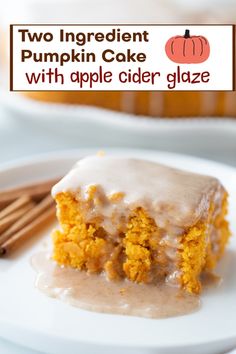 two ingredient pumpkin cake with apple cider glaze on a white plate next to cinnamon sticks