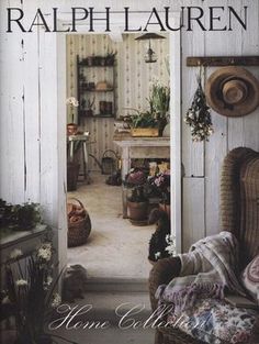 an open door leading into a room with flowers on the wall and furniture in it