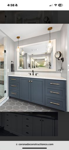 an image of a bathroom with blue cabinets