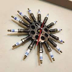 a clock made out of many different types of screws