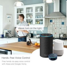 a man standing in a kitchen next to an echo voice controlled lighting device and other appliances