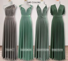 three dresses on mannequins, one in green and the other in grey