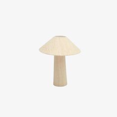 a small wooden mushroom lamp on a white background