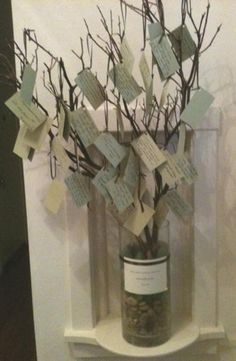 a vase filled with lots of notes and branches