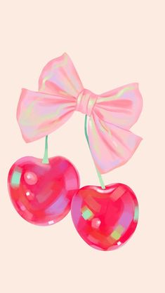 two cherries with a bow on them