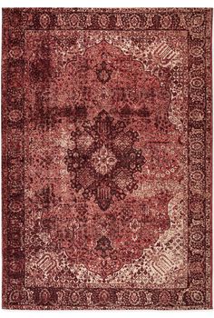 a red and beige rug with an intricate design on the center, surrounded by smaller medallions