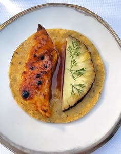 a white plate topped with food on top of a table