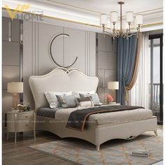 a bedroom with a large bed and chandelier