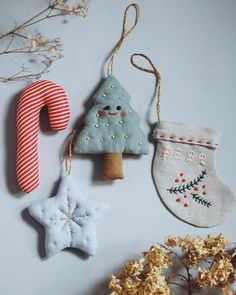 three ornaments are hanging on the wall