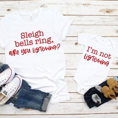 two shirts that say sleigh bells rings are you listening? and i'm not listening