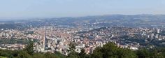 a view of a city from the top of a hill