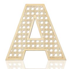 a wooden laser cut out letter with holes