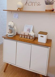 a counter with some items on it and a sign above it that says, home