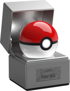 a poke ball is sitting on top of a silver box with a red and white object in it