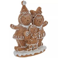 three gingerbread men standing on top of each other