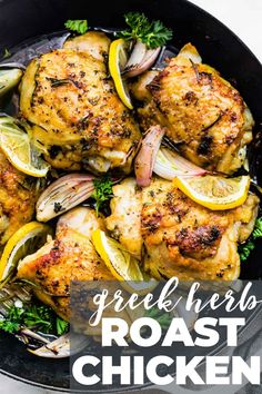 grilled chicken with lemons and herbs in a skillet on a white table