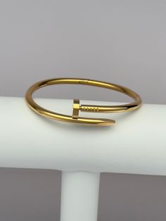 This stunning 18K gold nail cuff bracelet is both simple and distinctive, making it a versatile addition to your accessory collection. It can be worn alone or paired with your favorite bracelets for a fashionable stacked look. **Also comes in Silver! Nail Cuff Bracelet, Nail Cuff, Everyday Princess, Nail Bracelet, Gold Nail, Crystal Beads Bracelet, Gold Choker, Custom Name Necklace, Jewelry Photography