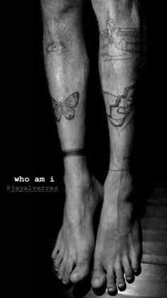 two people with tattoos on their legs standing next to each other