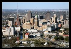 an aerial view of a city with tall buildings