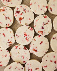 several cookies with cranberry toppings sitting on a table