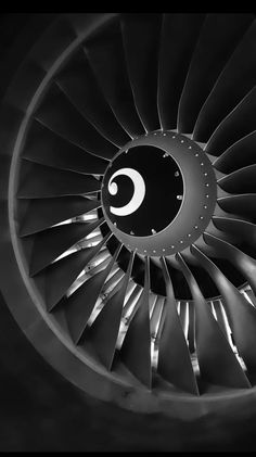 an airplane's turbine is seen in this black and white photo with the letter c on it