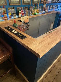 an empty bar with several bottles on the counter