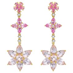 The Pink Sapphire Morganite Diamond Blossom Drop Earrings are an exquisite blend of sophistication and elegance. These enchanting earrings feature pink sapphires and morganite gems arranged in a floral drop design. The vibrant pink hues of the sapphires and the soft blush tones of the morganite create a beautiful contrast, while sparkling diamonds add a dazzling touch of luxury. Crafted in 14k gold, these earrings exhibit a delicate charm, perfect for making a statement at special occasions or e Convertible Earrings, Morganite Diamond, Blush Tones, Drop Design, Pink Morganite, Modern Earrings, Gold Drop Earrings, Sapphire Diamond, Sparkle Diamonds