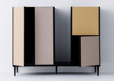 a cabinet with two different colored panels on the front and one black, tan, and white panel