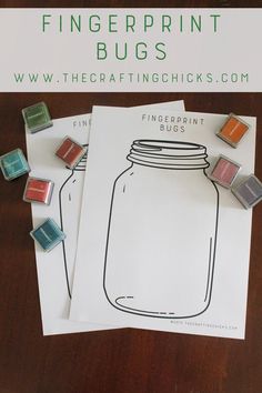 some rubber stamps sitting on top of a piece of paper next to a mason jar