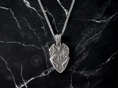 The Sterling Silver Handcrafted Skyrim Pendant by Stone & Stone. Handcrafted Stone & Stone oxidised pendant offer subtly, texture, and character.  Stone & Stone solid silver pendants are made from 925K solid sterling silver.  You can buy this pendant as a gift for your boyfriend or a gift for your girlfriend and you can make them happy. ✔ The pendant will be sent to you in a handmade wooden box, ready to give as a special gift.  ✔ Free and Fully Tracked Shipping ✔ Express Delivery options: 1 Business Day in the UK, 1-3 business days to Europe & USA I T E M  D E T A I L S: *  925K Sterling Silver, Solid Silver *  Finish : Oxidized *  Weight: 8-9 gr (may vary +/- 1 gr) *  Width:  0.85 inc (21.5 mm)  *  Height: 1.25 inches (31.7 mm) long (not including the jump ring) C H A I N   D E T A I L S Gift For Your Boyfriend, Handmade Wooden Boxes, Mens Necklace, Gifts For Your Boyfriend, Gifts For Your Girlfriend, Your Boyfriend, Men's Necklace, Silver Pendants, Skyrim