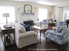 a living room filled with furniture and a fire place