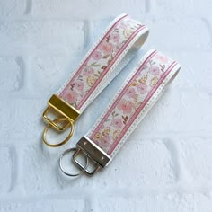 Cherry Blossom Vegan Leather Wristlet Keychain Key chain, Bridesmaid Gift Idea Gifts Under 20 For Her, Wristlet key fob, lanyard fob You are purchasing ONE wristlet keychain as shown in the photos above.  Designed with a combination of vegan leathers, this wristlet features an appliquéd center that can be monogrammed or personalized for an additional fee.   This wristlet is 5x1.25" not counting the hardware.   Due to the nature of the different vinyls, pattern placement will vary.  No two are ex Wrist Lanyard Aesthetic, Car Key Keychain, Wristlet Keychain Ideas, Aesthetic Keys, Key Chains Aesthetic, Car Keys Keychain Ideas, Car Keychain Ideas, Leather Wristlet Keychain, Cute Keychains