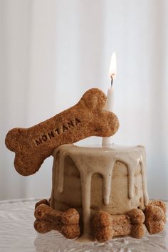 a birthday cake with a dog bone on top