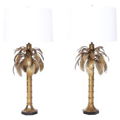 pair of brass palm tree lamps with white shades