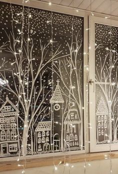 the window is decorated with white lights and trees