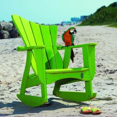 a green chair with a parrot sitting on top of it