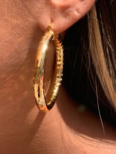 18kt Gold Filled Large Hoop Earrings- One of our Best selling hoops! Hoop Size: 55mm Width: 6mm Clasp: Hinged Tarnish Resistant-Hypoallergenic-Lightweight Material: 18 Karat Gold Filled, Hypoallergenic. Tarnish Resistant. Gold-filled does not de-laminate or peel like Gold plated Jewelry nor does it tarnish as readily as silver. Generally speaking, gold filled is better quality and will have a much longer lasting color than plated jewelry. We recommend keeping abrasive chemicals away from the jew Thick Gold Hoops Earrings, Golden Earrings Hoop, Gold Hoop Earrings Big, Big Gold Earrings, Trendy Gold Tarnish-resistant Hoop Earrings, Thick Golden Hoop Earrings, Luxury Gold Plated Tarnish-resistant Hoop Earrings, Hoop Earrings Aesthetic, Large Gold Earrings