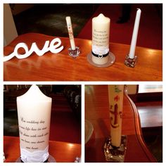 two candles and one candle holder with love written on the top, sitting on a table