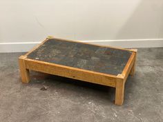 an old coffee table sitting on the floor