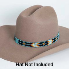 The Arapaho Turquoise Beaded Hat Band is a stylish and unique accessory that can give your hat a fresh new look. The band is made up of small, colorful beads that have been expertly strung together to create a beautiful pattern. The turquoise beads in particular add a touch of elegance and sophistication to any hat.**Please note this is the hatband only** Turquoise Hats With Short Brim, Blue Festival Hat Band One Size Fits Most, Blue Festival Hat Bands One Size Fits Most, Adjustable Turquoise Hat For Festival, Western Turquoise Beaded Hat Bands, Blue Artisan Hat With Adjustable Fit, Blue Festival Hat Bands One Size, Adjustable Turquoise Hat Bands For Festivals, Adjustable Southwestern Turquoise Hat Bands