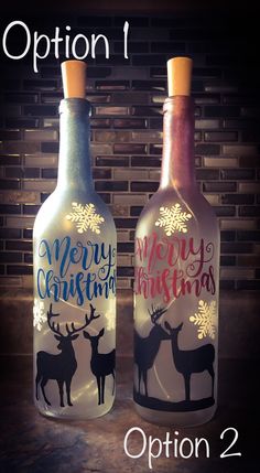 two wine bottles with christmas designs on them